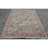 Green ground Middle Eastern carpet 240cm by 168cm