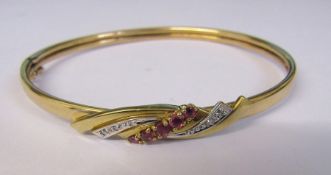 9ct gold ruby and diamond chip bangle weight 7.3 g D 6 cm