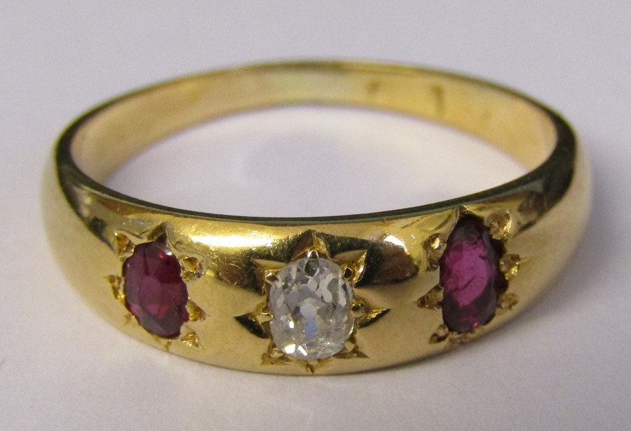 Tested as 18ct gold ruby and diamond gypsy ring (diamond 0.20 ct) size N/O weight 3.5 g