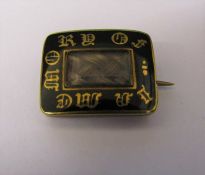 Tested as 14 ct gold mourning brooch with enamel detail and plaited lock of hair 15 mm x 13 mm