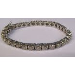 18ct white gold 14 ct diamond tennis bracelet L 6.5" consisting of 31 solitaire diamonds, colour