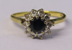 18ct gold sapphire and diamond cluster ring Sheffield 1904 weight 4.1 g (sapphire 0.75 ct, total