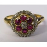 18ct gold ruby and diamond cluster ring (total ruby 0.50 ct, central diamond 0.035ct) c.1885 size