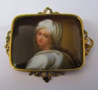 Tested as 15ct gold brooch with painted plaque of a young woman size 50 mm x 43 mm total weight 9.