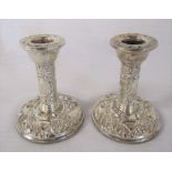 Pair of ornate silver candlesticks Birmingham 1954 (weighted base) maker Broadway & Co H 10 cm