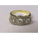 Tested as 18ct gold diamond trilogy ring, central diamond 0.33 ct, outer diamonds 0.15 ct and