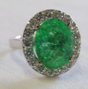 18ct gold emerald and diamond cluster ring, emerald 5.6 ct (11 mm x 13 mm) diamond total 1.00 ct,