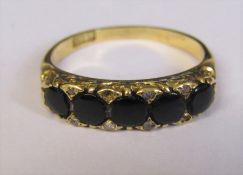 18ct gold 5 stone jet and diamond chip ring (2 diamonds missing) weight 3.5 g size O