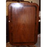 A Regency mahogany and rosewood banded rectangular tilt top breakfast table, on turned column and