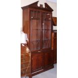 A George III design mahogany bookcase, the upper section with broken pediment
