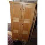 A custom made beech side cupboard enclosed six panel doors with steel knobs, 20" wide, on square