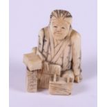 A mid 20th century Chinese ivory figure of a seated scholar, 1 1/2" high