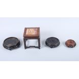 A Chinese hardwood and marble inset stand, 5" square, and three others