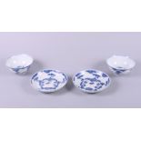 A pair of Chinese porcelain blue and white bowls and saucers, decorated clouds, six character