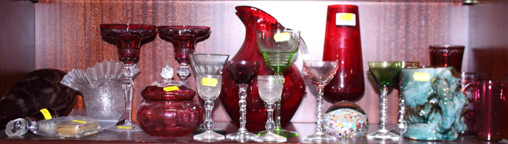 A cranberry glass jug, a number of cranberry drinking glasses and various other glassware