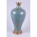 An early 20th century Chinese cloisonne baluster vase with floral decoration on a scale ground, 13