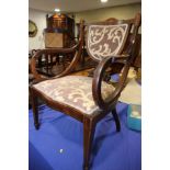 An Edwardian walnut and inlaid scroll arm chair, on square taper supports