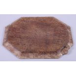 A Robert "Mouseman" Thompson carved oak elongated octagonal cheese board, 12" x 10"