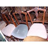 A set of three 19th century walnut side chairs with pierced top rails and stuffed over seats, on