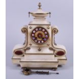 A late 19th century white marble and brass mounted mantel clock with urn finial and blue and white