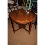 A walnut circular two-tier occasional table, on later bun feet, 20" high