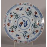 An 18th century Bristol delft plate with polychrome floral decoration, 8 3/8" dia (stabilised crack)