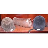 Two riding helmets and two leather gaiters