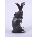 A 19th century Japanese bronze model of a rat with a radish, 8 1/2" high