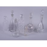 Seven cut glass decanters, various sizes (damages)