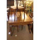 A French walnut draw leaf dining table, on cabriole supports, top 38" x 96" when fully extended