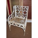 A pair of 19th century Carron ironworks pattern cast iron Gothic tracery armchairs