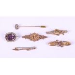 A 9ct gold floral design brooch mounted seed pearls, a similar seed pearl mounted bar brooch, two