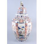 A faience jar and cover with chinoiserie decoration and lion finial, said to be from the estate of