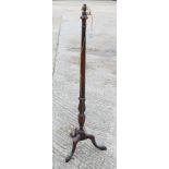 A mahogany reeded column standard lamp, on tripod splay support