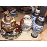A pair of Chinese blue and white crackle glazed vases and covers, decorated dragons, a Satsuma