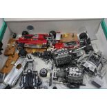 A collection of model Formula 1 cars and engines, various