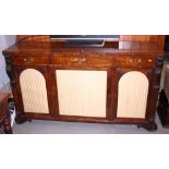 A mid 19th century rosewood side board, fitted three drawers over two arch top and one rectangular