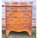 A figured walnut and banded serpentine front chest of four drawers with slide over, on bracket feet,