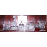 A pair of cut glass vases, a Deco style decanter and four matching glasses, a cut glass rose bowl