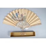 A Duvelleroy mother-of-pearl fan with hand-painted figure decorated vane, 10 3/4" long, in