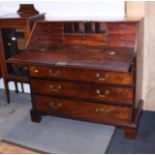 A George III mahogany fall front bureau with fitted interior, drawers, pigeon holes and secret