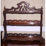 A 19th century rosewood three-tier open wall shelf, 26" wide