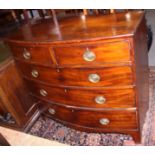 An early Victorian mahogany bowfront chest of two short and three long drawers with stamped brass