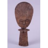 An African carved wooden figure of a woman, 10" high