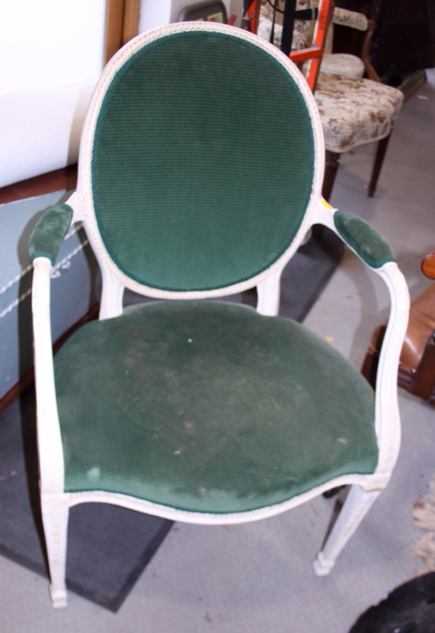 A late Georgian white painted open armchair of Adam design with cameo back, on square taper