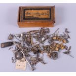 A number of silver, white and yellow metal watch chains (mostly as found), a propelling pencil,