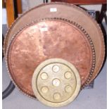 An Egyptian engraved copper tray, 25" dia, another, 22" dia, and a brass tray, 13" dia