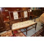 An Edwardian walnut and inlaid two-seat chair back settle, on square taper and stretchered splay