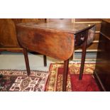 An early 19th century mahogany Pembroke table, fitted one drawer, on square taper supports, 36"