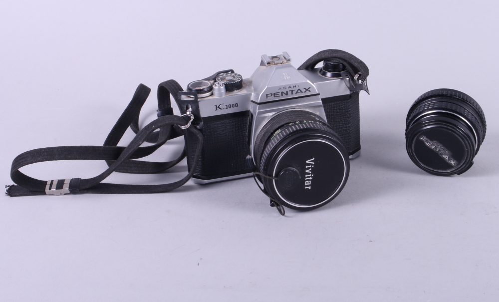 An Asahi Pentax K1000 SLR camera with a 1:2.5 28mm Vivitar auto wide angle lens and a 1:1.7 50mm